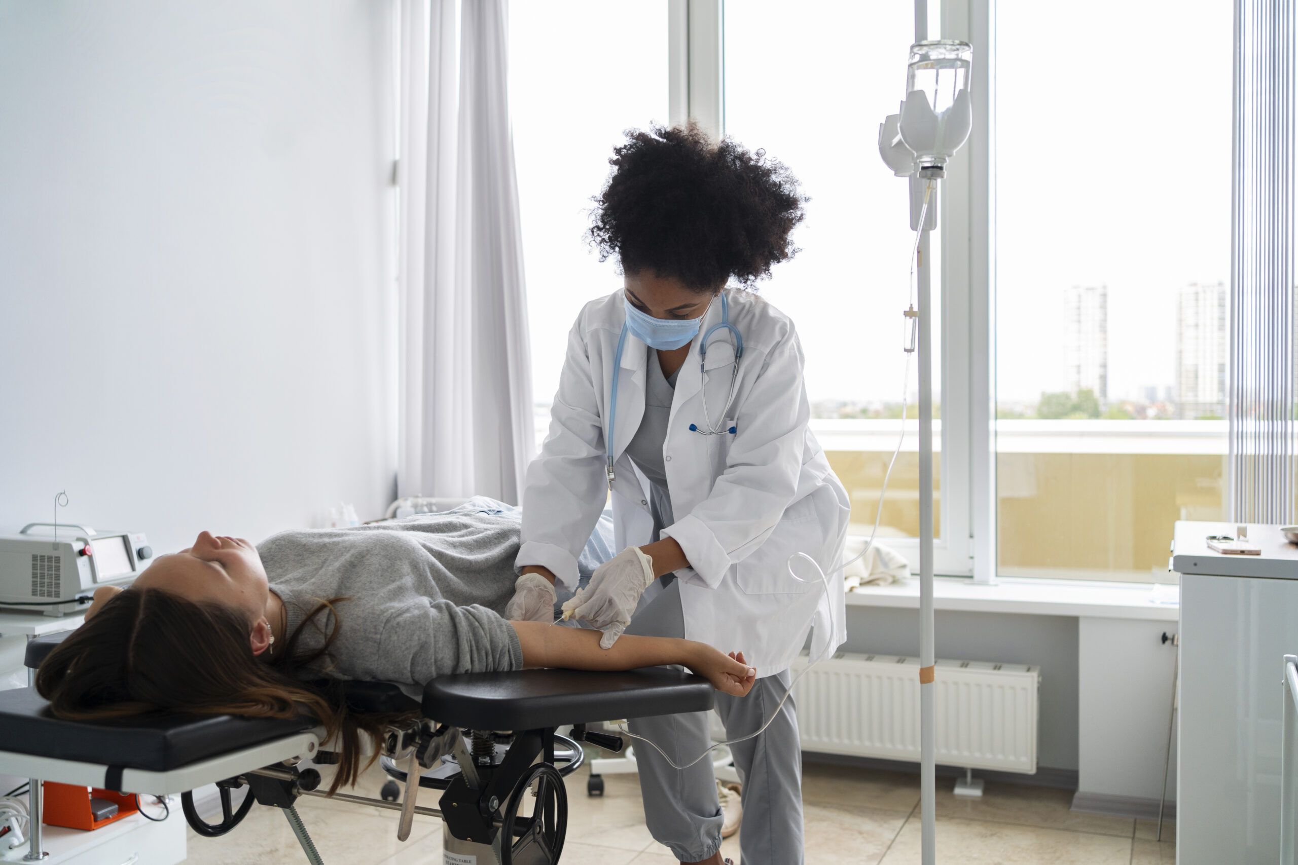 black female doctor wearing mask side view